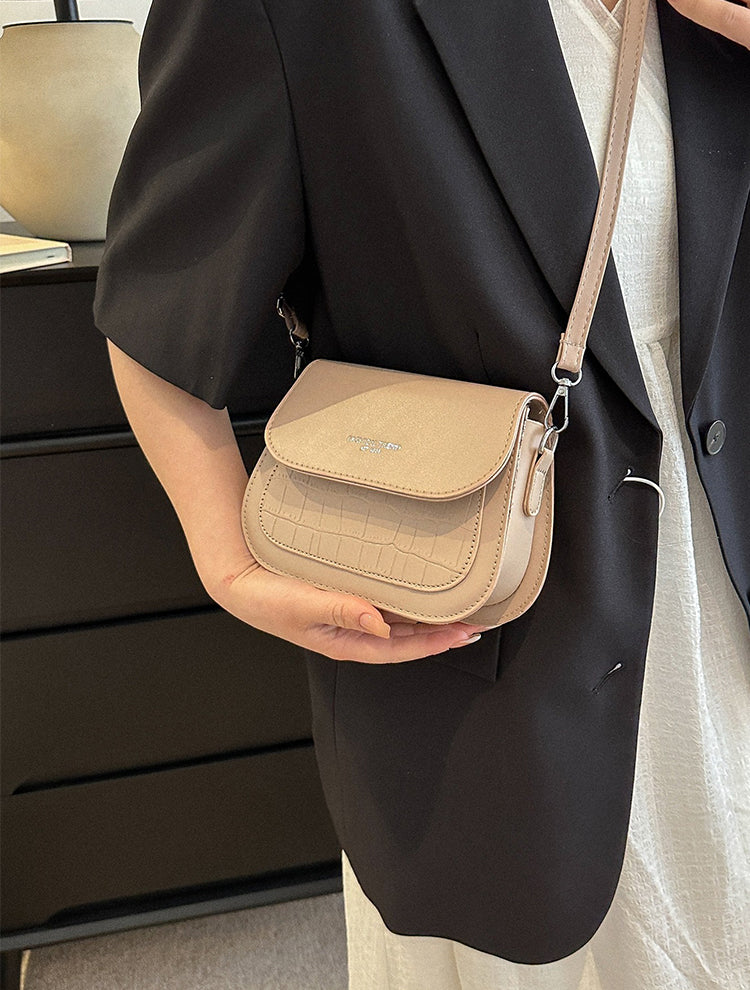 Fashionable textured design crossbody saddle bag