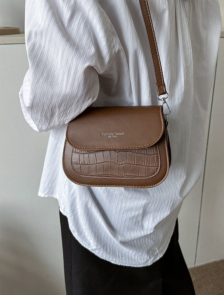 Fashionable textured design crossbody saddle bag