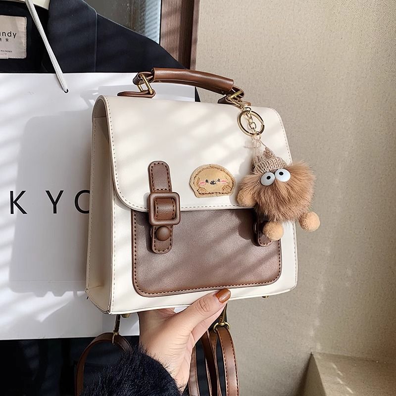 กระเป๋าเป้สะพายหลังแบบมีหัวเข็มขัดสีน้ำตาลสไตล์เรโทรเรียบง่าย / 3 สี