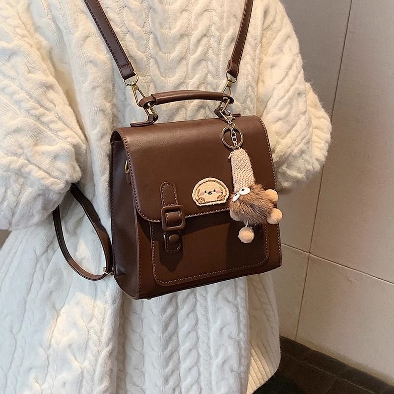 กระเป๋าเป้สะพายหลังแบบมีหัวเข็มขัดสีน้ำตาลสไตล์เรโทรเรียบง่าย / 3 สี