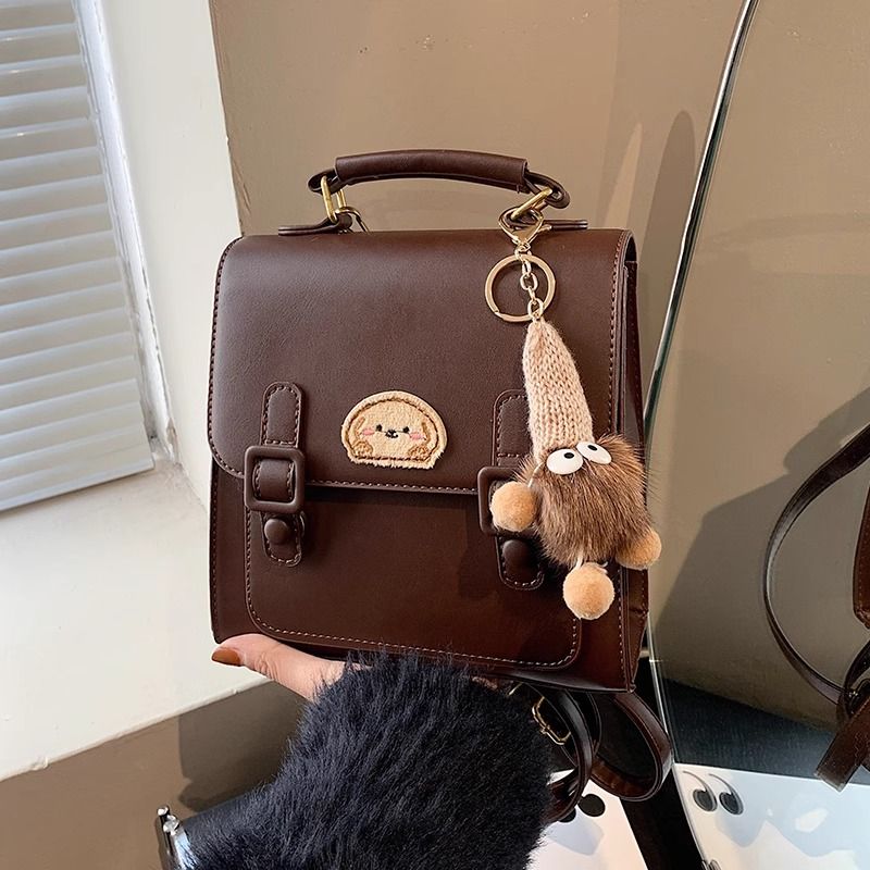 กระเป๋าเป้สะพายหลังแบบมีหัวเข็มขัดสีน้ำตาลสไตล์เรโทรเรียบง่าย / 3 สี